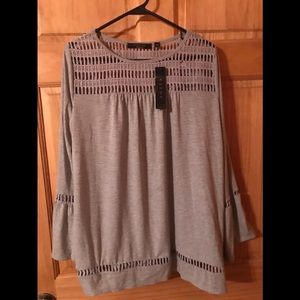 Cyrus woman gray top. NWT.
